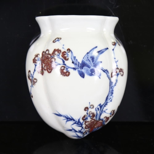 117 - A Chinese blue and white porcelain wall vase, with iron red decoration and seal mark, height 12cm