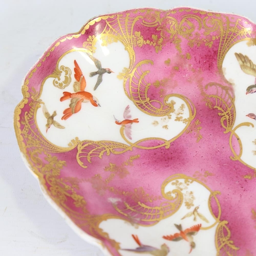 128 - An oval porcelain dish, 18th or 19th century, hand painted and gilded bird decorated panels, with go... 