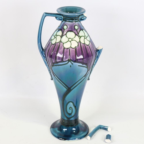 134 - A Minton secessionist ceramic vase, pattern no. 3, with relief moulded designs, height 31cm, 1 handl... 