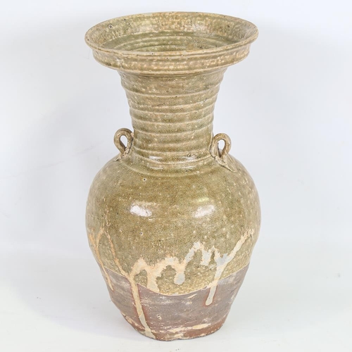 136 - A Chinese Han Dynasty Hu form vase with ring handles, height 27cm, rim diameter 14cm