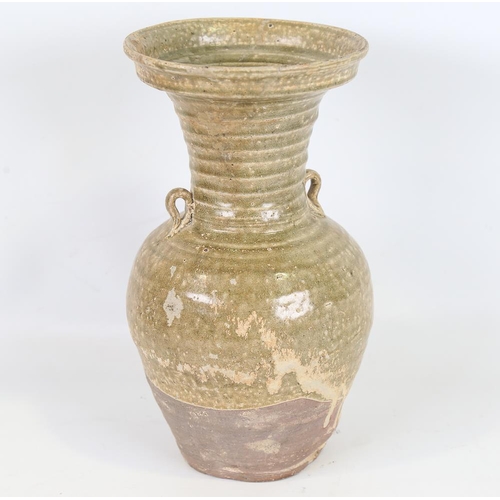 136 - A Chinese Han Dynasty Hu form vase with ring handles, height 27cm, rim diameter 14cm