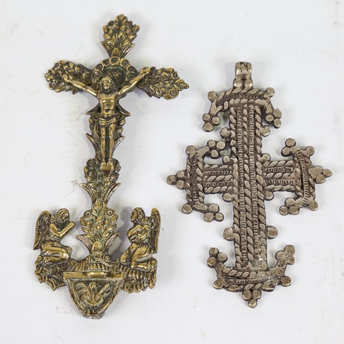 137 - An Ethiopian cross pendant, length 12cm, and a Continental relief cast-brass cross, height 16cm (2)