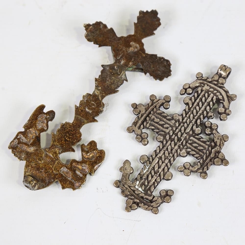 137 - An Ethiopian cross pendant, length 12cm, and a Continental relief cast-brass cross, height 16cm (2)