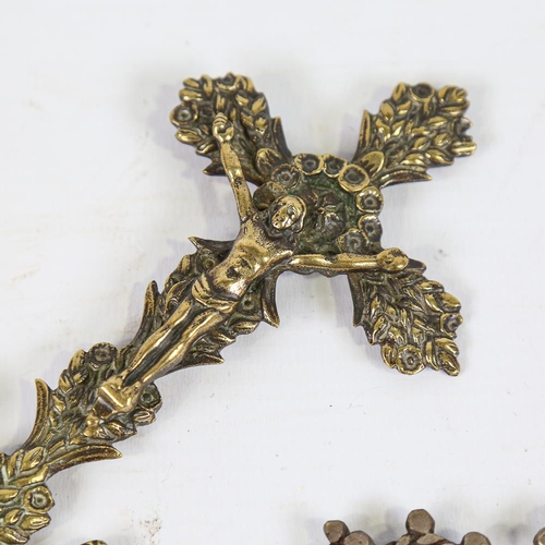 137 - An Ethiopian cross pendant, length 12cm, and a Continental relief cast-brass cross, height 16cm (2)