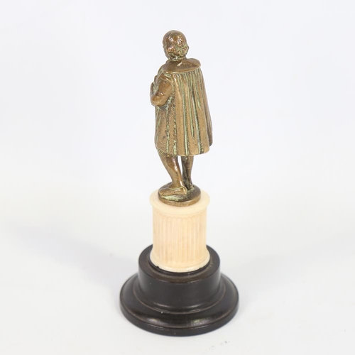 140 - A bronze figure of Shakespeare on carved ivory and ebonised base, height 15.5cm