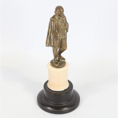 140 - A bronze figure of Shakespeare on carved ivory and ebonised base, height 15.5cm