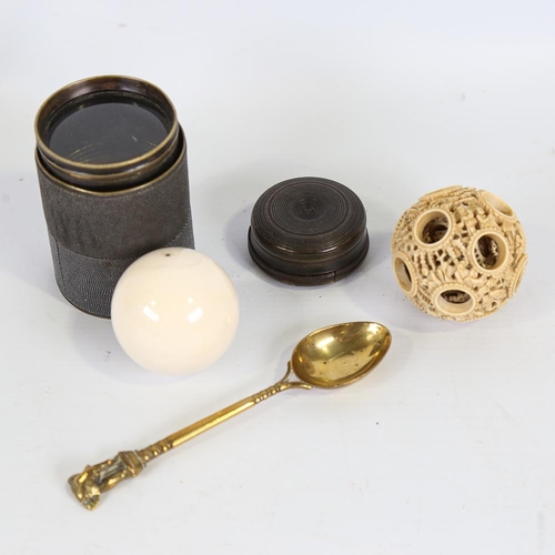 142 - A mixed group of items, including Chinese ivory puzzle ball, ivory snooker ball, magnifier lens, hor... 