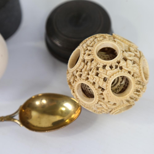 142 - A mixed group of items, including Chinese ivory puzzle ball, ivory snooker ball, magnifier lens, hor... 