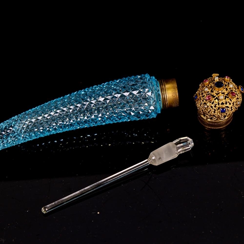 148 - An Austrian faceted blue glass cornucopia perfume bottle, with stone set gilt metal cap and original... 