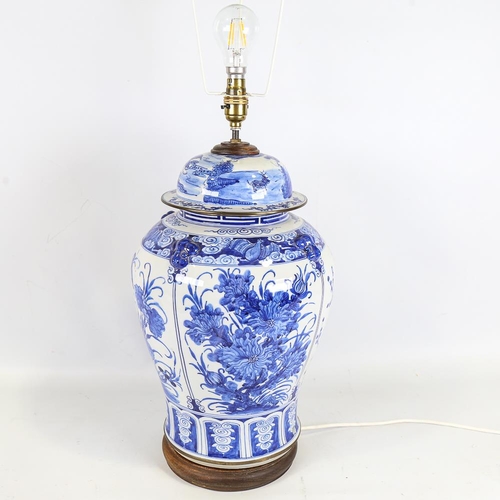 152 - A Chinese blue and white porcelain table lamp on wooden base, height to top of jar 44cm