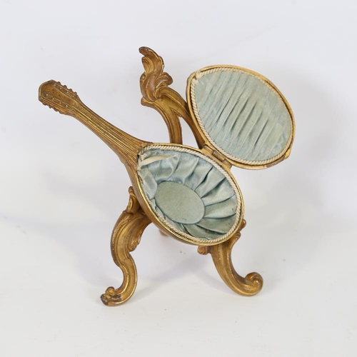 160 - A 19th century French gilt-brass cased trinket box, in the shape of a mandolin on stand, hinged cove... 