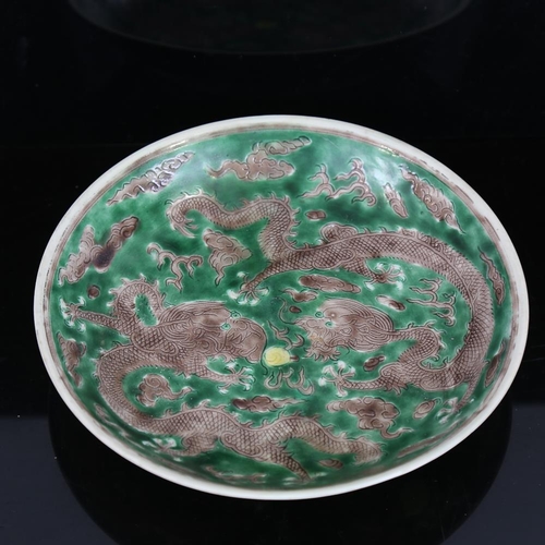 175 - A Chinese green glaze porcelain dragon bowl, 6 character mark, 19cm across, restored