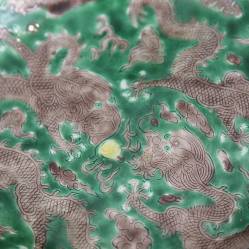 175 - A Chinese green glaze porcelain dragon bowl, 6 character mark, 19cm across, restored