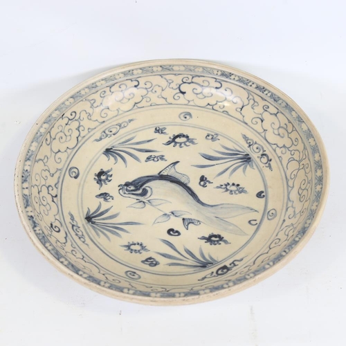 177 - A Chinese blue and white ceramic bowl, with hand painted fish design, diameter 34cm