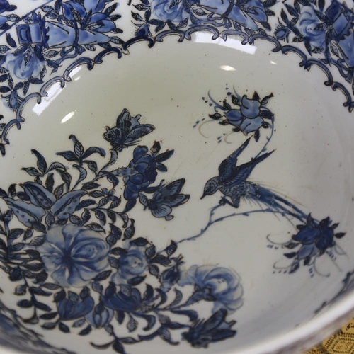 181 - A Chinese blue and white porcelain bowl, with painted exotic birds and flowers, 6 character mark, di... 