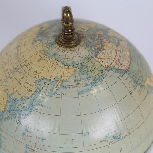 192 - A tinplate and brass desk globe, height 36cm, diameter approx 16cm