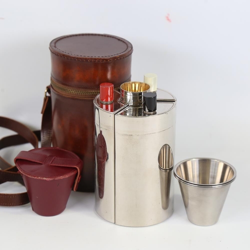 195 - A plated stirrup cup set, containing 3 decanters and drinking tots in cylindrical leather case, case... 