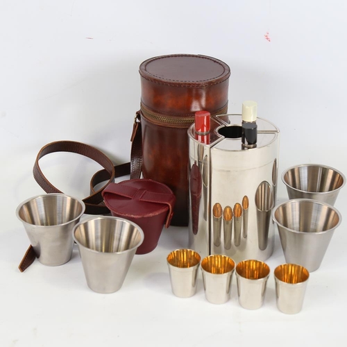 195 - A plated stirrup cup set, containing 3 decanters and drinking tots in cylindrical leather case, case... 