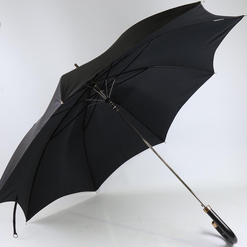 196 - A Dunhill umbrella with gold plated mounts