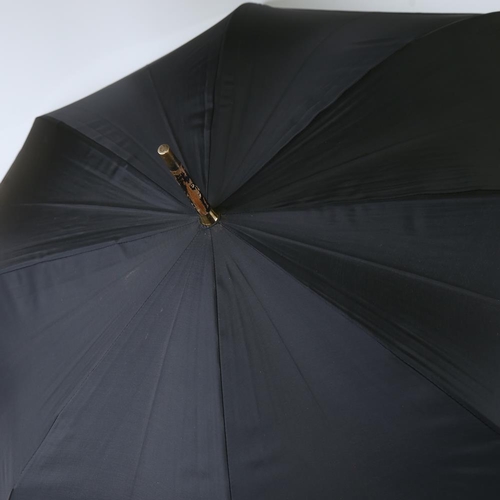 196 - A Dunhill umbrella with gold plated mounts