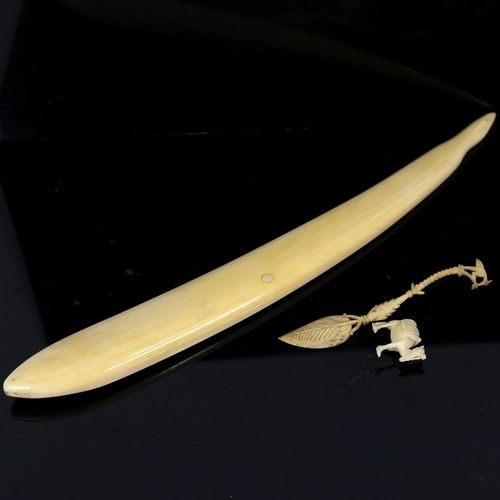 205 - A marine ivory Cribbage marker, early 20th century, length 33cm, together with an ornate carved bone... 