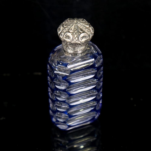 206 - A small blue overlay cut-glass perfume bottle, with unmarked white metal top, height 7cm