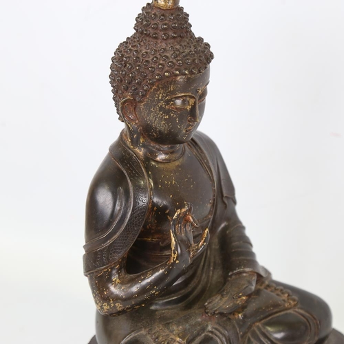 212 - A Chinese patinated bronze seated Buddha, height 36cm