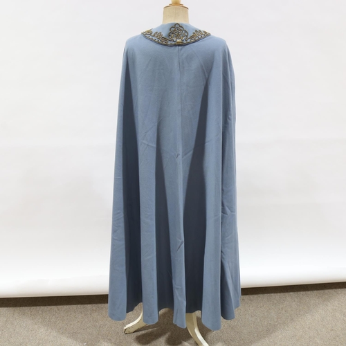 227 - A 1950s opera cloak with gold braid collar