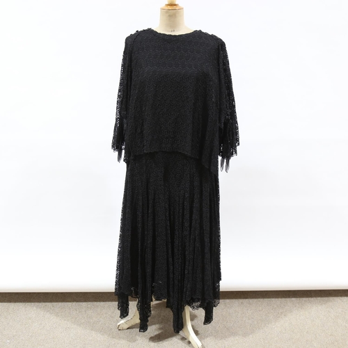 228 - A heavy lace embroidered black evening dress, circa 1890 - 1910, fully lined