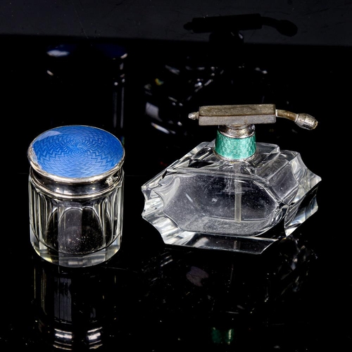 253 - An Art Deco cut-glass perfume bottle with nickel and enamel atomiser top, and a silver and blue enam... 