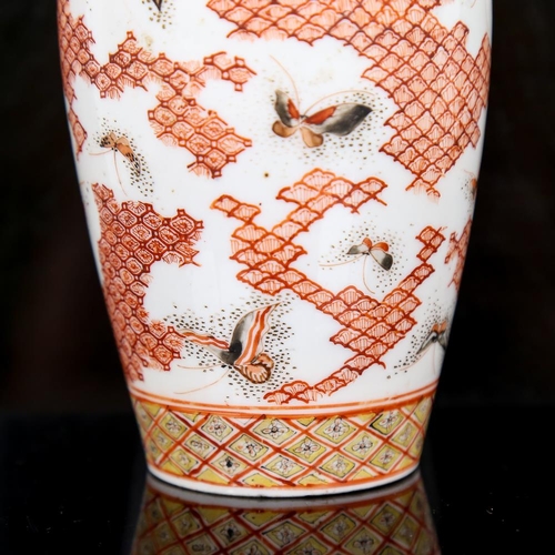 257 - A Japanese porcelain vase, with painted butterflies and geometric design, signed under base, height ... 