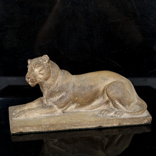 258 - A hand sculpted clay lioness, early 20th century, unsigned, length 27cm