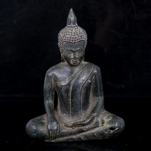 259 - An Oriental patinated bronze seated Buddha, thought to be 15th/16th century, height 14.5cm