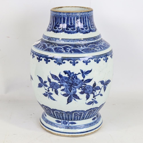 261 - A Chinese blue and white porcelain vase, hand painted prunus decoration, height 28cm, base drilled