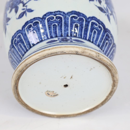 261 - A Chinese blue and white porcelain vase, hand painted prunus decoration, height 28cm, base drilled