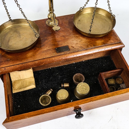 285 - Victorian brass balance scales, on mahogany base with drawer under and weights, by V H Marsden & Co ... 