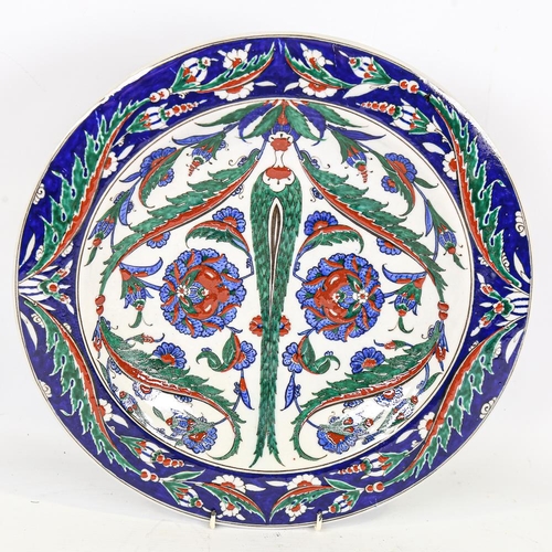 291 - 19th century Turkish Iznik pottery plate, with hand painted decoration, diameter 36cm