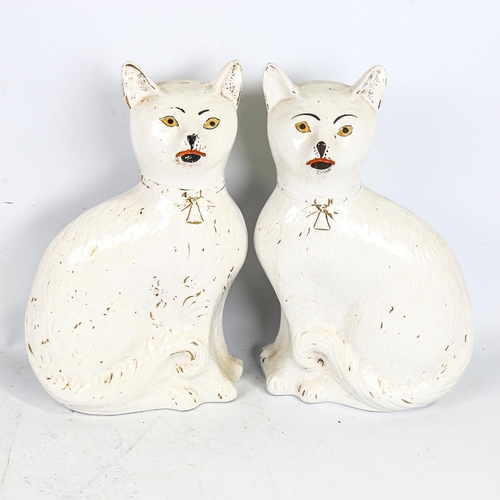 294 - A rare pair of 19th century Staffordshire Pottery seated cats, height 34cm