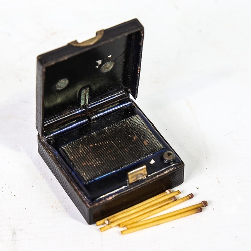 301 - A Victorian Asprey & Sons leather and brass-covered matchbox, with brass carrying handle and striker... 