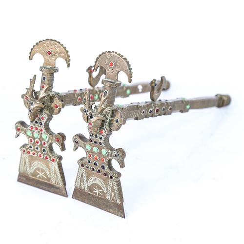 306 - A pair of South American brass ceremonial axes, with inset coloured glass bosses, length 30cm