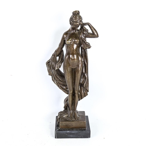 307 - A reproduction patinated bronze sculpture, female nude, unsigned, on black marble base, height 43cm