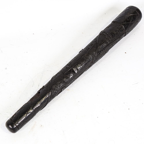 310 - An Irish bog oak club, with relief carved shamrock designs, length 39cm