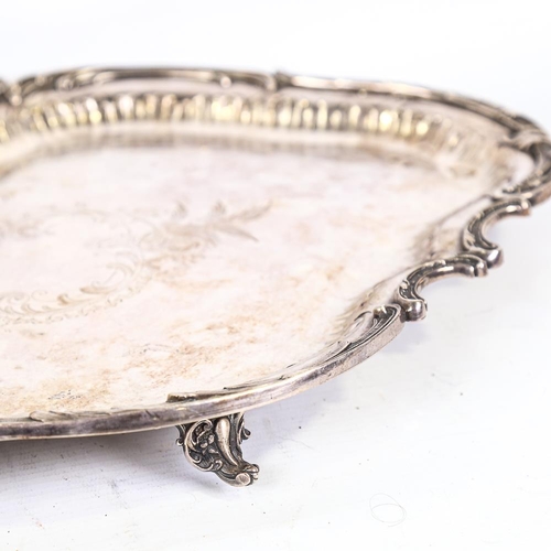 311 - WMF - electroplate tea tray with shaped and scrolled relief cast surround, length 47cm