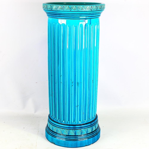 312 - A Burmantofts turquoise glaze pottery stick stand, height 59cm, diameter 26cm