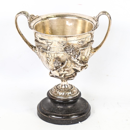 314 - A 19th century electroplate 2-handled chalice, with high relief cast Classical figures on marble bas... 