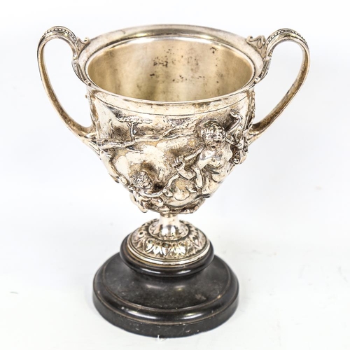 314 - A 19th century electroplate 2-handled chalice, with high relief cast Classical figures on marble bas... 