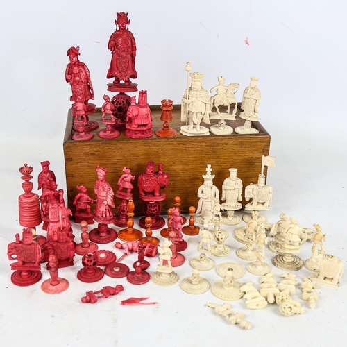 315 - A collection of 19th century red and white stained ivory chessmen