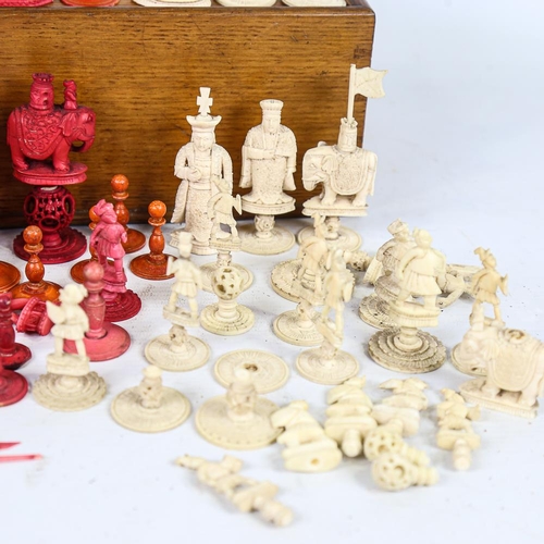 315 - A collection of 19th century red and white stained ivory chessmen