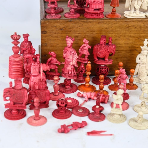 315 - A collection of 19th century red and white stained ivory chessmen