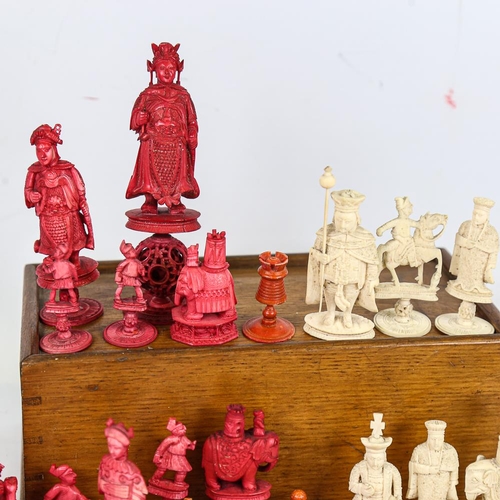 315 - A collection of 19th century red and white stained ivory chessmen